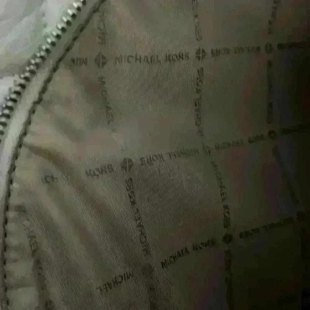 Michael Kors Abbey white quilted backpack. Silver hardware. Two zipper pockets. - Picture 7 of 12